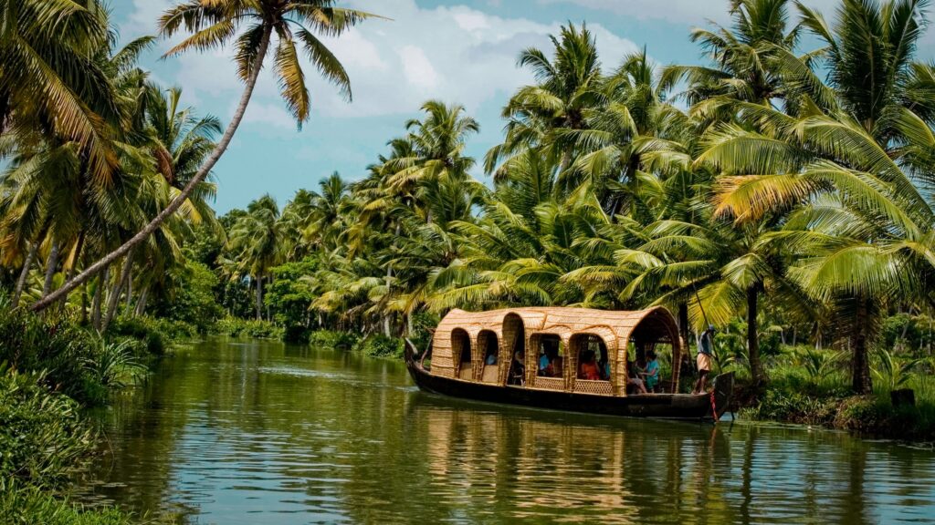 Traditional houseboat cruise through the peaceful Kerala backwaters on our South India tours.