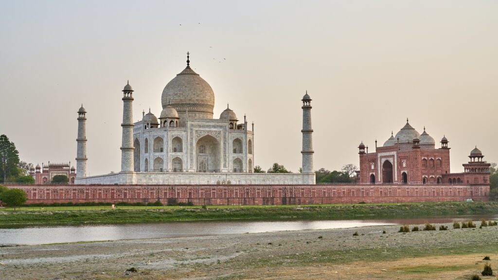 Sunrise at the Taj Mahal in Agra, a highlight of our Golden Triangle tour packages.