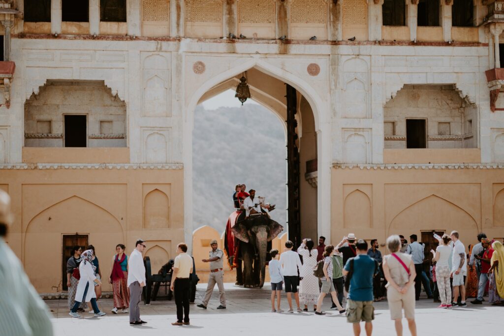 Travelers at Amer Fort courtyard during Jaipur tour - Rajasthan 7-day package