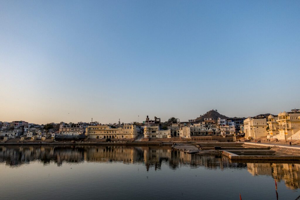 Sacred Pushkar Lake with pilgrims during spiritual stop on 7-day Jaipur Pushkar Udaipur tour
