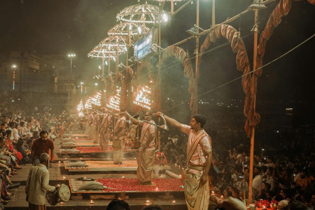 Evening Ganga Aarti ceremony on the ghats of Varanasi - spiritual and cultural tour of India with Shamrock Journeys.
