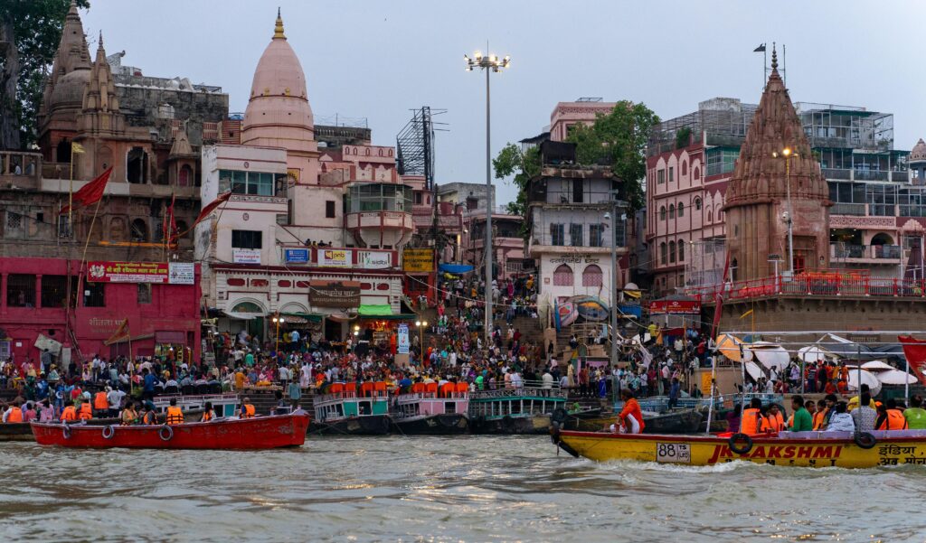 Devotees at the golden spire of the sacred Kashi Vishwanath Temple, Varanasi, on a guided spiritual tour.