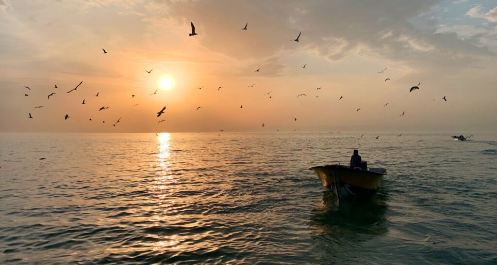 Sunrise view of the sacred Triveni Sangam in Prayagraj, where the Ganges and Yamuna rivers meet