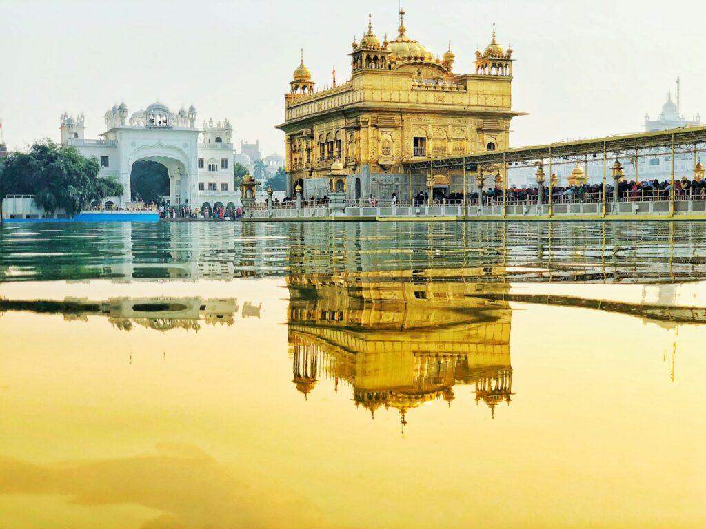 Golden Temple (Harmandir Sahib) reflecting in the holy pool at sunrise, first day of Amritsar tour.