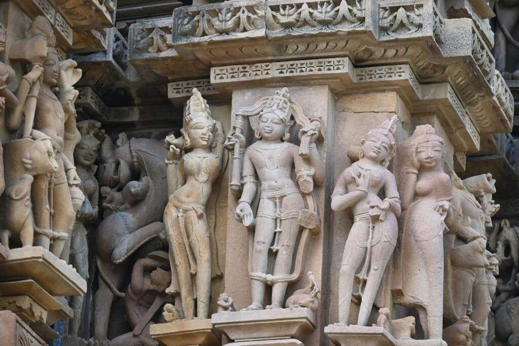 Detailed close-up of the famous stone carvings and sculptures at the Khajuraho temples, depicting ancient Indian art and symbolism.