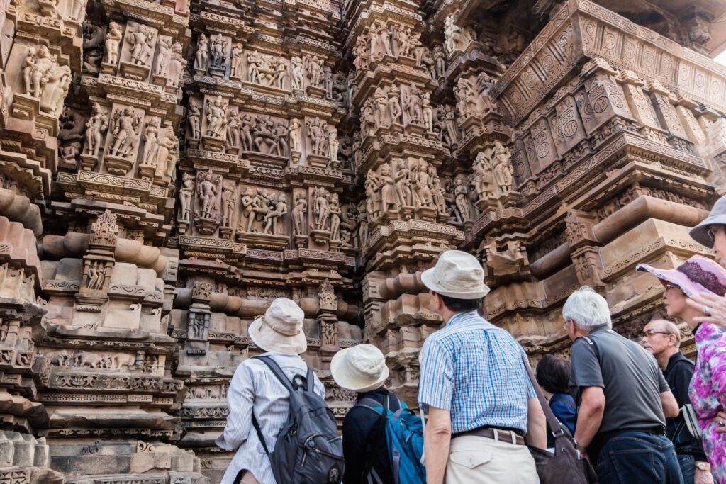 Intricate stone carving detail on Khajuraho Temple, Madhya Pradesh - UNESCO site for temple and architectural heritage tours.