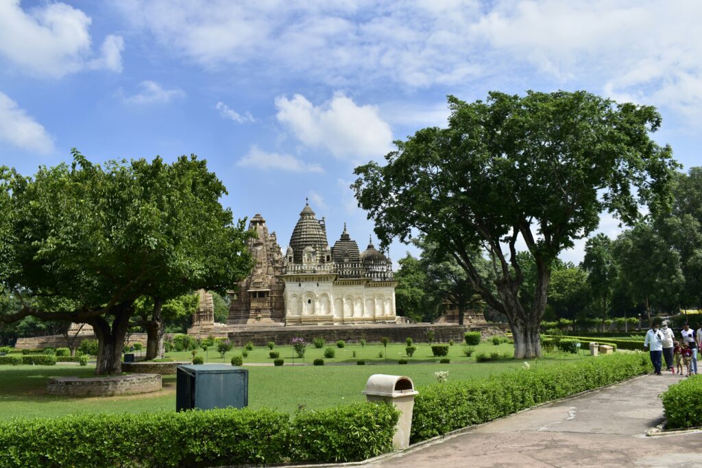 Small group of travelers with a Shamrock Journeys guide on a cultural walking tour through a historic Central Indian town.