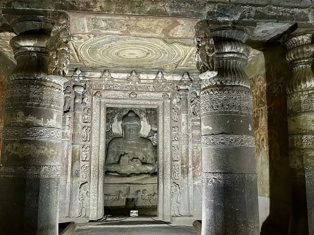 Detailed sculpture of a seated Buddha in Cave 1 at Ajanta Caves