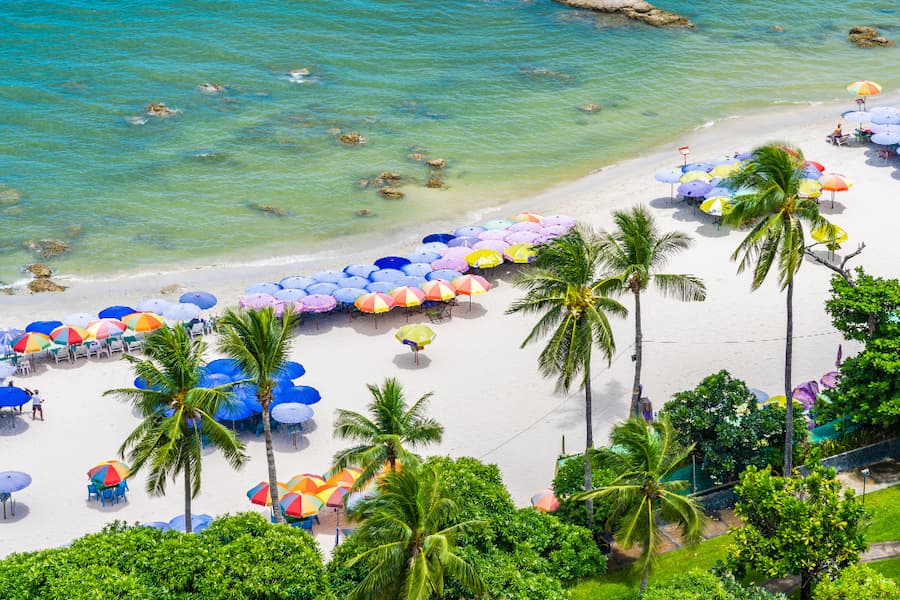 Tourists enjoying water sports and beach shacks at Baga Beach, North Goa