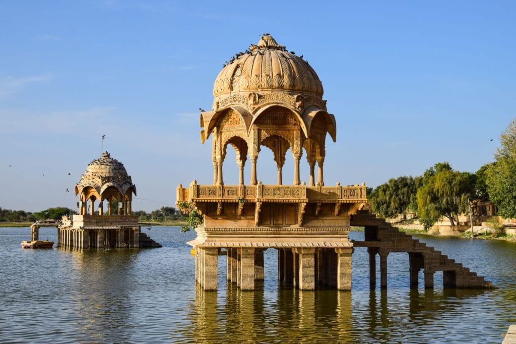 Gadisar Lake in Jaisalmer, surrounded by ghats and temples, ideal for an evening boat ride