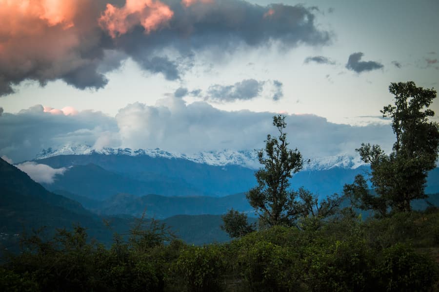 Travelers enjoying the sunrise Himalayan viewpoint on a Kausani tour package