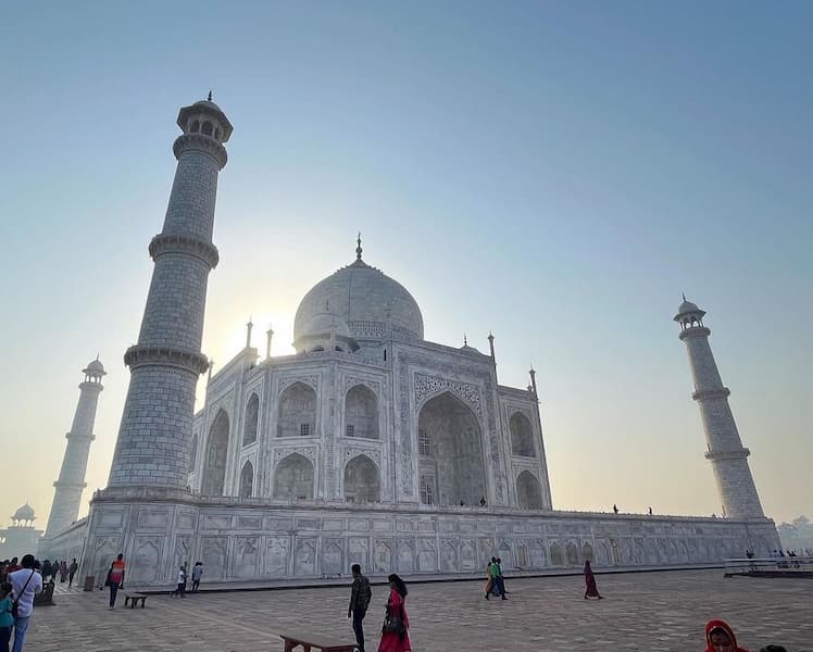 Heritage tour of India at the Taj Mahal at sunrise, a small group enjoying the iconic view