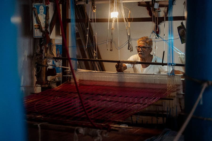 Varanasi travel guide: Weaver making a Banarasi silk sari on a handloom in Varanasi