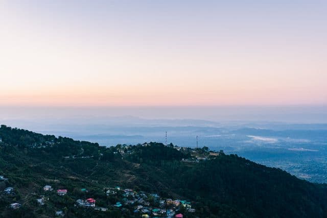 Aerial view of Dalhousie hill town on pine-covered hills during Dalhousie tour packages