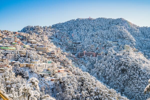 Snow on the roofs and forests of Shimla in winter