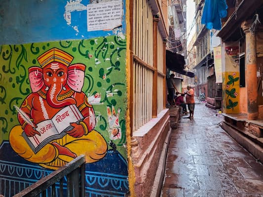 Local guide on a heritage walk through the narrow lanes of old Varanasi